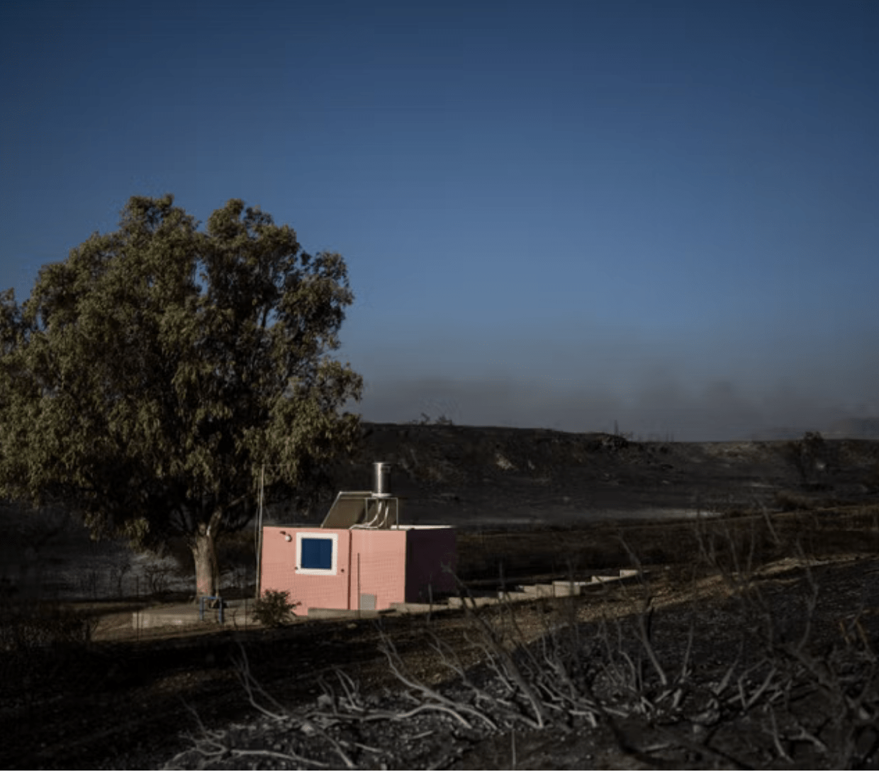 Exclusion zone set up around Greek military base after wildfires trigger powerful explosions